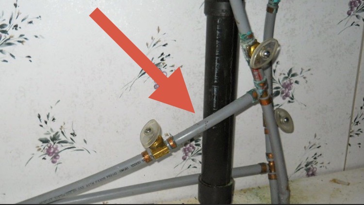 Gray polybutylene plumbing pipe documented during Florida 4-point inspection