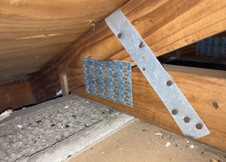 Hurricane strap roof-to-wall connection documented during wind mitigation inspection